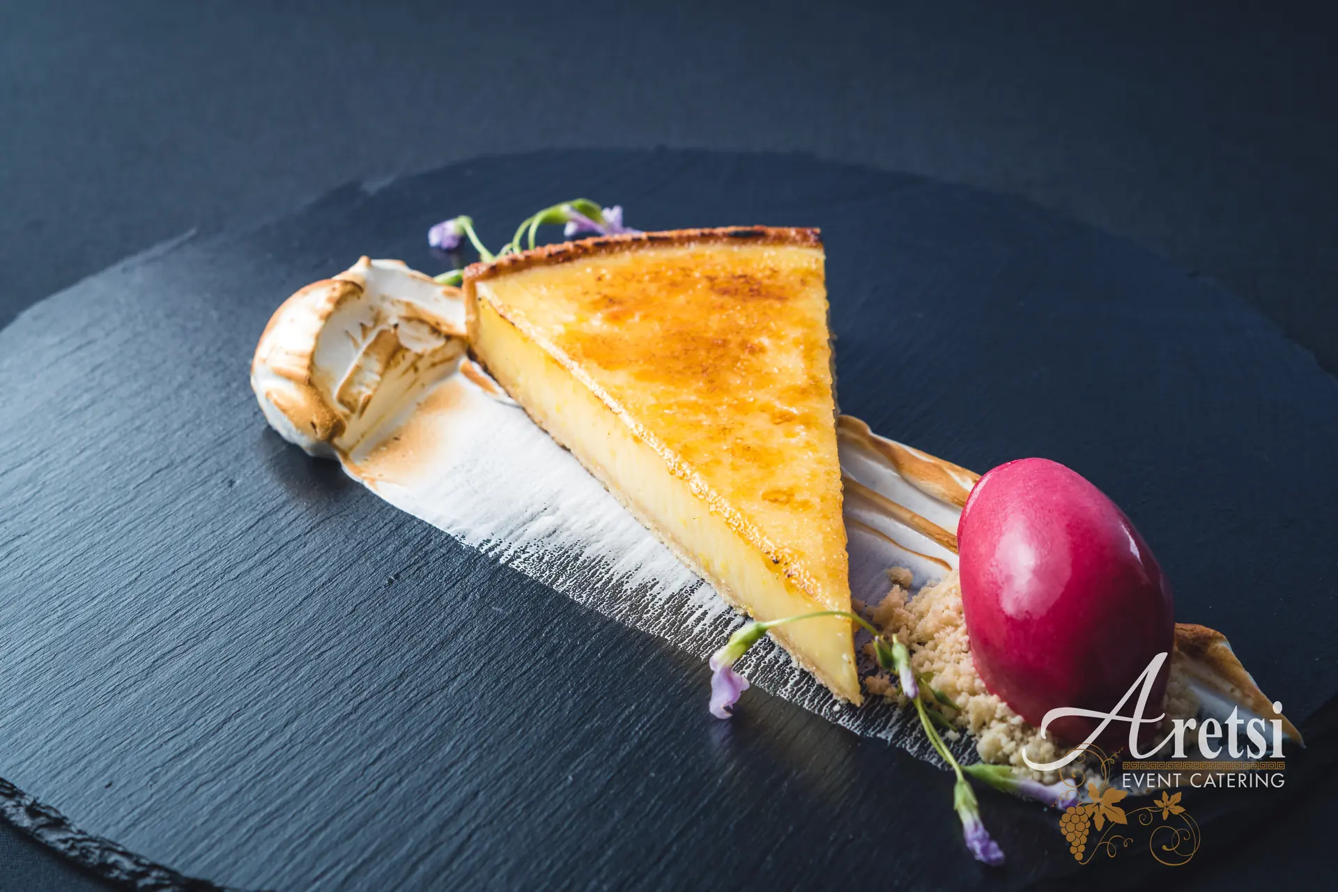 Lemon tart with toasted meringue and berry sorbet, an Aretsi dessert