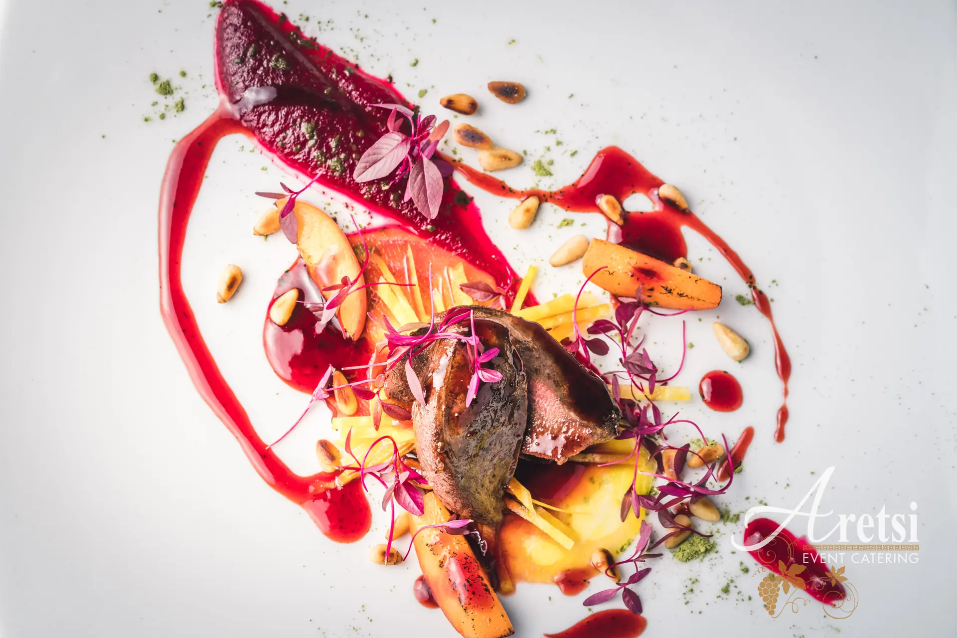 A plated Aretsi main course with beetroot and a bright red sauce