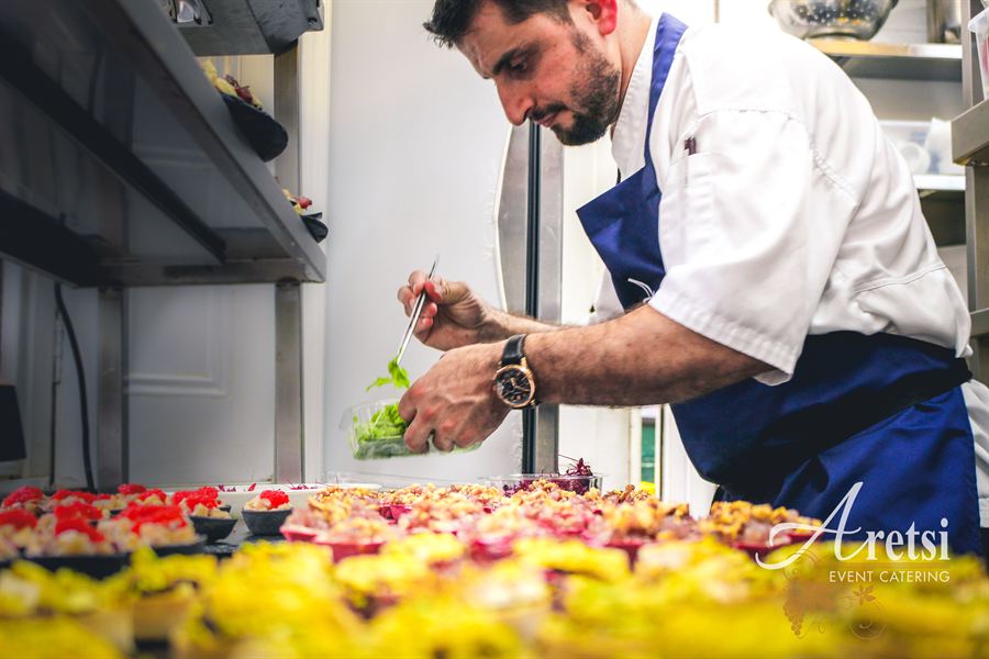 An Aretsi chef finishing canapés in the kitchen