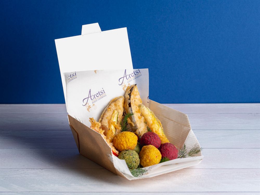 Vegetable fritters and a trio of beetroot, turmeric and herb falafel in an Aretsi box